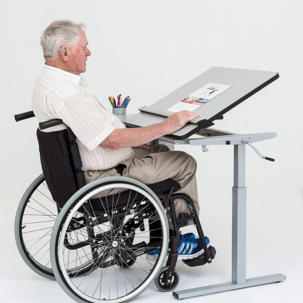 wheelchair user sitting at the ergo desk