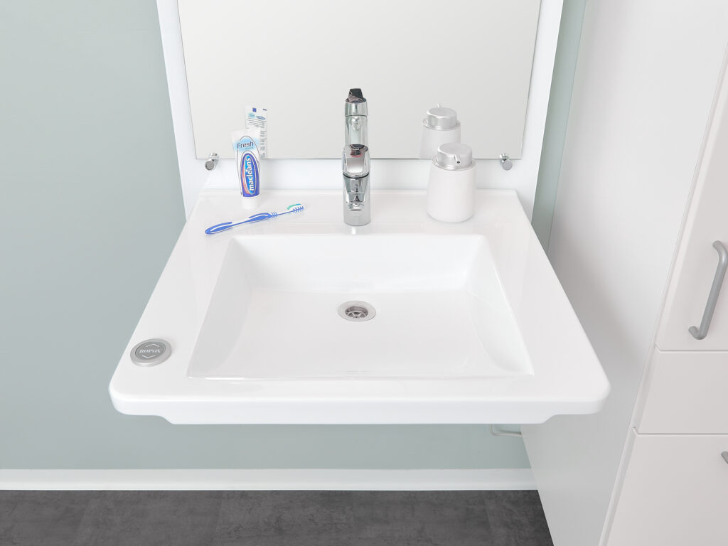 Slimline electric height adjustable washbasin