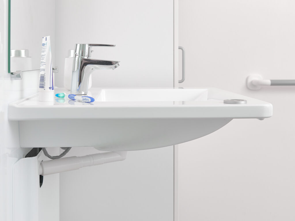 Slimline electric height adjustable washbasin