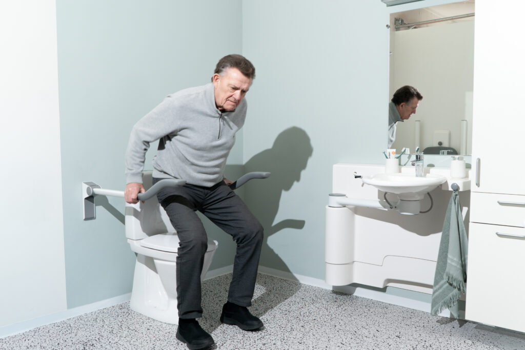 toilet support arms with user